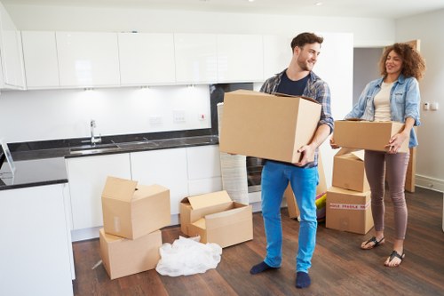 Transport team handling boxed goods during a move