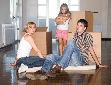 Packed boxes and furniture ready for a local Brook Green move
